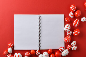 Easter backgrounds invitation layout with a blank sheet of Easter red and white eggs on a bright red background.