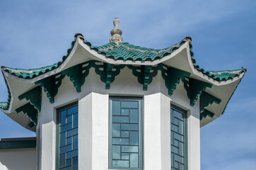 Green and White Chinese Pavilion Under Blue Skies.