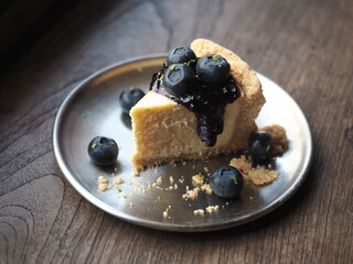 blueberry cheesecake plate on wood