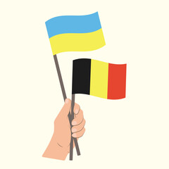 Flags of Ukraine and Belgium, Hand Holding flags