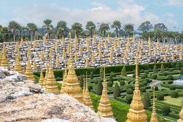 Golden stupas. Nong Nooch Tropical Garden. panorama view of Nong Nooch garden located at Pattaya,...