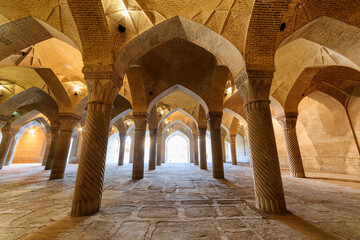 Wonderful hypostyle hall in the Vakil Mosque in Shiraz, Iran