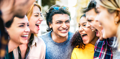 Trendy friends cheering together out side on genuine life style concept - Young guys and girls...