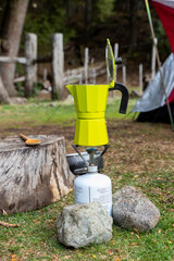 Fototapeta premium preparation of coffee in a campsite with a coffee machine