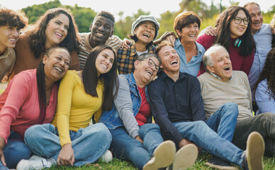 Group of multi generational people having fun together outdoor - Multiracial friends enjoy day at...