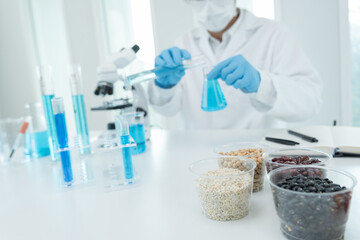 Scientist check chemical whole grains residues in laboratory. Control experts inspect the concentration of chemical residues. hazards, standard, prohibited substances, contaminate, Microbiologist