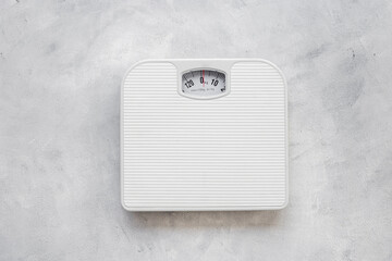 White weight scales on the floor. Weight measurement and loss concept