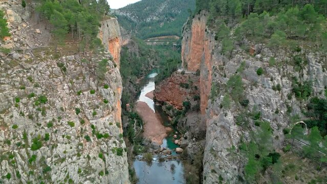 flight along a beautiful gorge with a river running through it