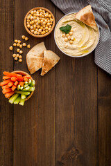 Chickpea hummus with vegetables sticks and pita croutons