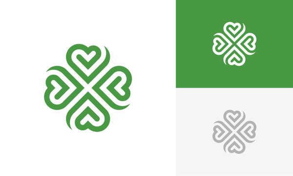 green clover with heart shape logo design vector