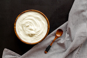 Bowl of sour cream or yogurt. Dairy product background