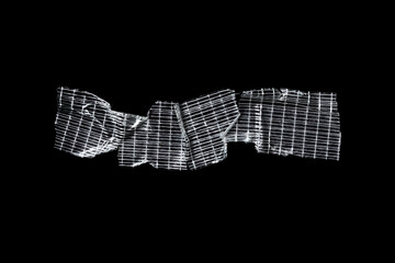 Transparent adhesive tape strips isolated on black background crumpled clear plastic sticky snips texture overlay