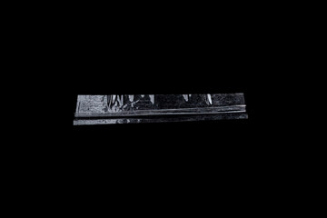 Transparent adhesive tape strips isolated on black background crumpled clear plastic sticky snips texture overlay