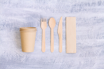 zero waste, plastic free,recyclable, sustainable utensils including fork, spoon, knife, cups and a napkin with copy space. Top view, overhead view ,above view or a flat lay composition