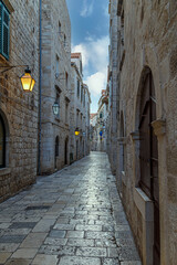 Fototapeta premium Medieval stone street, illuminated by lanterns. Dubrovnik. Croatia. Europe