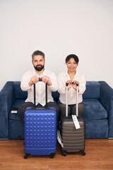 Young couple of tourists in hotel room