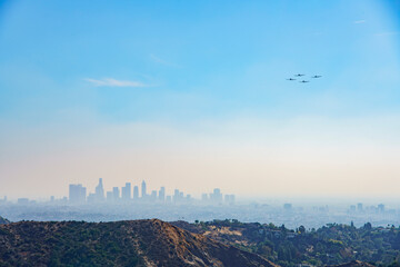 Sunny view of the Los Angeles cityscape with Fighter jet
