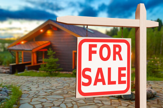 Cottage for sale. Sign for sale for house. Buying and selling rural real estate. Wooden house is blurred. Realtor wooden signboard. Residential real estate auction. Villa or house for sale. 3d image