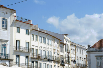 Fototapeta na wymiar Whitewashed vintage classical buildings downtown Evora, Portugal