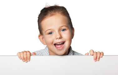 Little smiling girl with white blank close up on  background