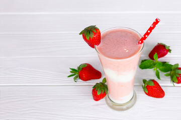 Strawberry yogurt fruit juice smoothie pink colorful fruit juice milkshake blend beverage healthy high protein the taste yummy In glass drink episode morning on white wood background.