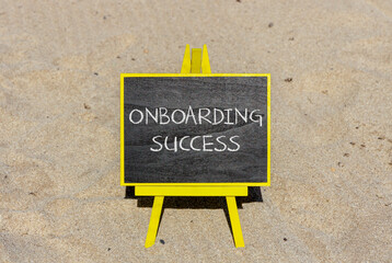 Onboarding success symbol. Concept words Onboarding success on black chalk blackboard on a beautiful sand beach background. Business onboarding success concept. Copy space.