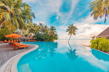 Stunning landscape, swimming pool blue sky with clouds. Tropical resort hotel in Maldives....