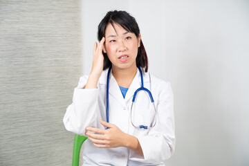 Asian female doctor during a consultation.