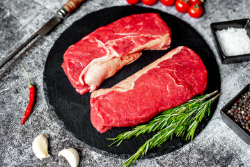 raw beef steak on stone background