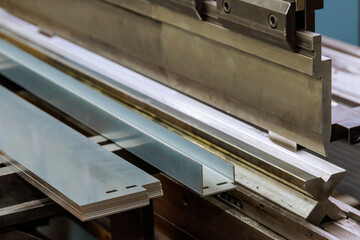 Working with sheet metal and special bending machines. hydraulic press brake or bending machine for sheet metal.