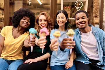 Focus on the happy face of multiethnic people with an ice cream