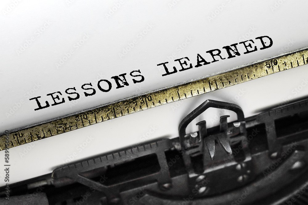 Poster text lessons learned typed on retro typewriter