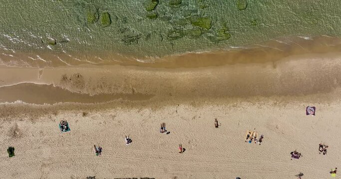 Aerial footage of people sunbathing on a beach in Tel Aviv. Filmed in C4K Apple ProRes 422 HQ