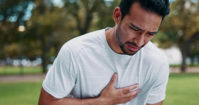 Chest pain, park and man with fitness injury from nature challenge, performance workout or sports exercise. Cardiovascular risk problem, training athlete and hurt person with heart attack emergency