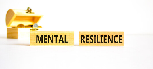 Mental resilience symbol. Concept word Mental resilience on wooden blocks. Beautiful white table...
