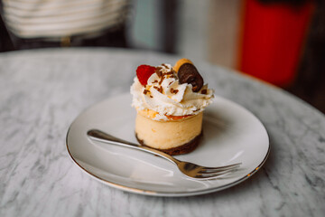 Close up image of a beautiful woman eating chocolate cake at cafe. High quality photo