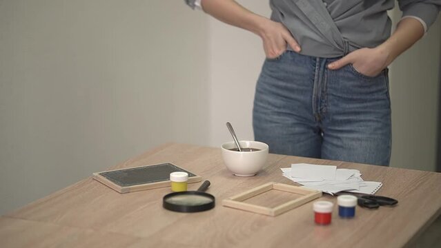 a woman brought coffee and put it on the table.. video in real time. High-quality shooting FullHD