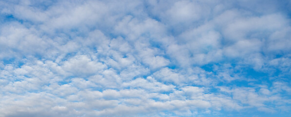 Blue sky with white cirrus clouds, panorama