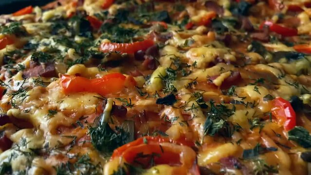 Very tasty pizza. Homemade extra long pizza. Wiring, endless pizza. Very tasty pizza with vegetables and grilled sausage. Hot golden crust, straight from the oven. Home-cooked Italian fast food. 