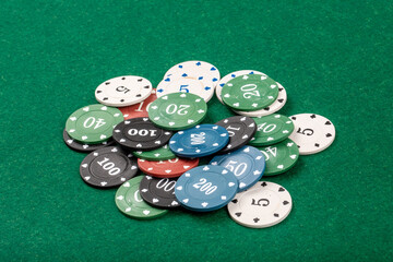 Pile of Poker Chips on Green Velvet Table, Casino and Gambling