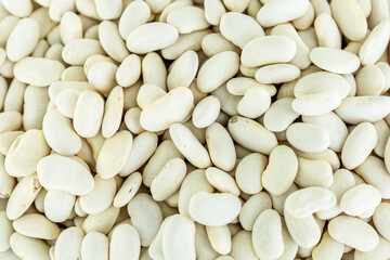 Dry white beans. Health and natural products. Close-up. Background. Space for text. Top view.