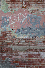 Old painted rouge worn brick wall 