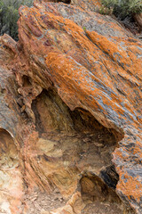 craks and splits  on rough surface of colorful metamorphic boulder, Worcester