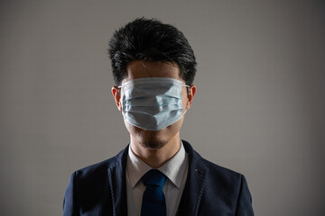 Man wearing a mask over his eyes.