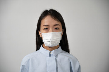 Young woman wearing protective mask.