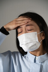 Young woman wearing protective mask.