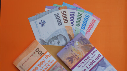 New edition of Indonesian banknotes in a brown envelope for THR (tunjangan hari raya) and salary.
