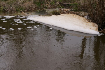 foam on the water of the river