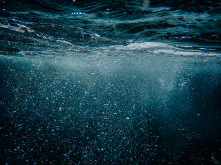 Bubbles under the sea in the crystal clear green sea water. Mediterranean bubbles. Real image very...