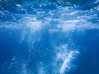 Bubbles under the sea in the crystal clear green sea water. Mediterranean bubbles. Real image very...